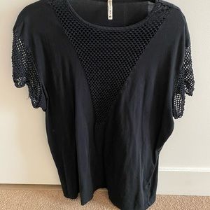 LF black shirt with mesh accents.